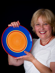 Image showing Mature Woman with colorful plate