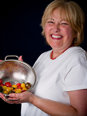 Image showing Mature Woman with tomatoes