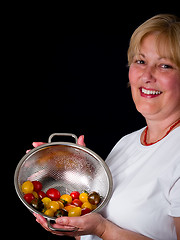 Image showing Mature Woman with tomatoes