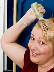 Image showing Mature Woman Dyeing Hair