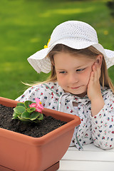 Image showing Little girl  - gardening