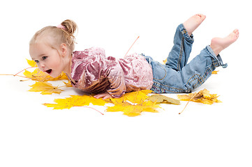 Image showing Toddler with maple leaves