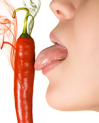 Image showing licking chili pepper 