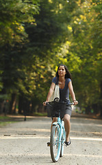 Image showing Woman Riding A Bicycle