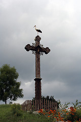 Image showing A Stork on a Cross