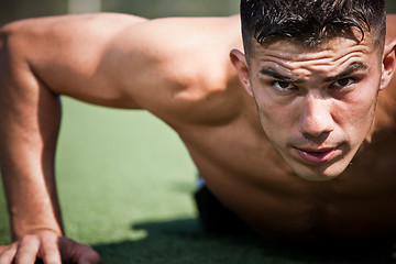 Image showing Hispanic athlete push-up