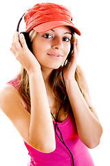 Image showing Young woman listen music