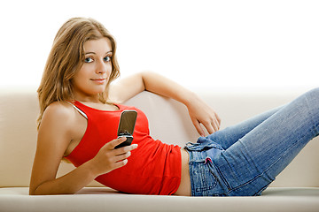 Image showing Young woman with a cell phone