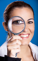 Image showing Looking through a magnifying Glass