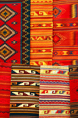 Image showing Colorful carpets hanging on the market. Oaxaca, Mexico