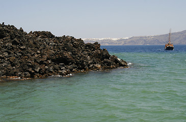 Image showing Sail boat sailing in waters by the Santorini island, Greece