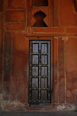 Image showing Beautiful wooden door with golden flowers on it. Fatehpur Sikri,