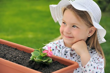 Image showing Little girl  - gardening