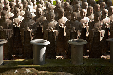 Image showing Stone monks statues