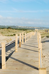 Image showing Boardwalk entering the beach