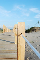 Image showing Close up of a boardwalk entering the beach