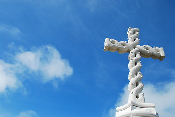 Image showing Cross in clouds and blue sky