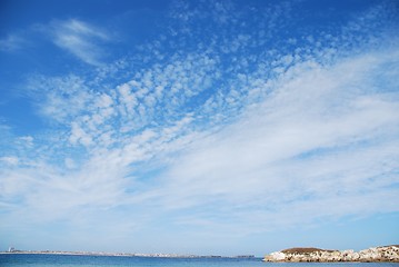 Image showing Huge rock at Baleal beach (dramatic cloudscape)