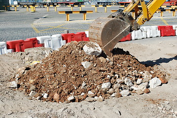 Image showing Caterpillar digging at a construction site