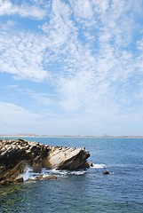 Image showing Huge rock at Baleal beach (dramatic cloudscape)