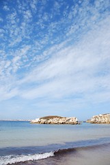 Image showing Huge rock at Baleal beach (dramatic cloudscape)