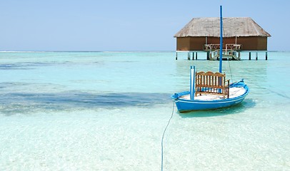 Image showing Honeymoon villa in Maldives and typical boat