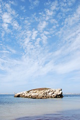 Image showing Huge rock at Baleal beach (dramatic cloudscape)