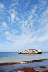 Image showing Huge rock at Baleal beach (dramatic cloudscape)