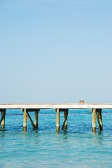 Image showing Wooden jetty bridge on a beautiful Maldivian beach