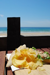 Image showing Tuna sandwich with beach front