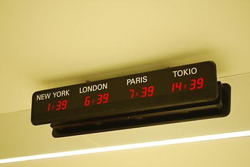 Image showing Timezone clocks at a international airport