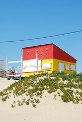 Image showing Yellow and red fisherman house