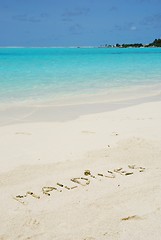 Image showing Maldives written in a sandy tropical beach