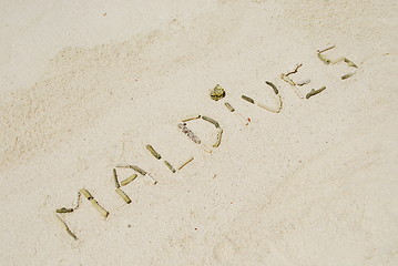 Image showing Maldives written in a sandy tropical beach