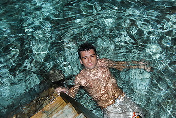Image showing Young man enjoying Maldives water (night shoot)