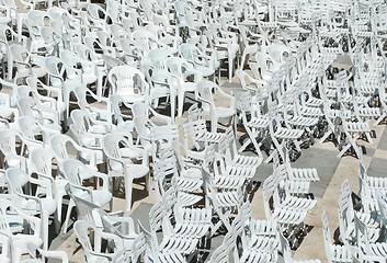 Image showing White plastic chairs background