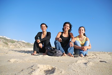 Image showing Smiling sisters at the beach