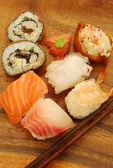 Image showing Complete sushi meal with nigiris and rolls