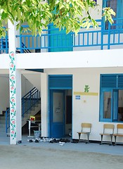 Image showing Blue Maldivian school with trainers outside