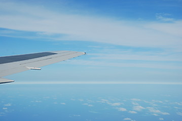 Image showing Airplane wing view with gorgeous clouscape