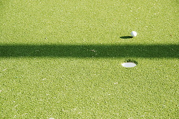 Image showing Golf green and ball on movement