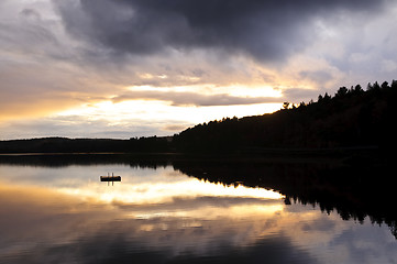 Image showing Lake sunset over forest