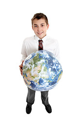 Image showing Smiling boy holding the world earth