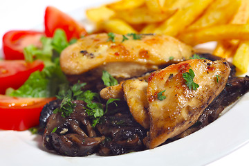 Image showing Chicken breasts on mushrooms angled