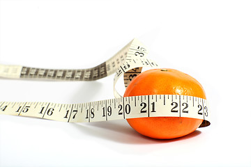 Image showing Orange with a measuring tape