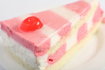 Image showing A slice of strawberry and vanilla mousse cake