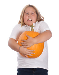 Image showing Girl Holding Large Pumpkin