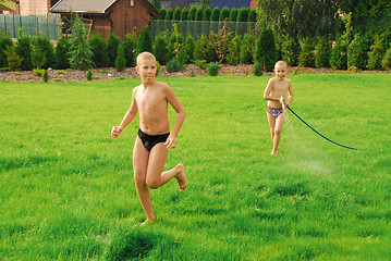 Image showing boys play on the grass