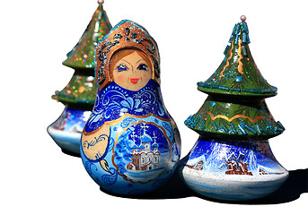 Image showing Snow Maiden among New Year trees. Nested dolls