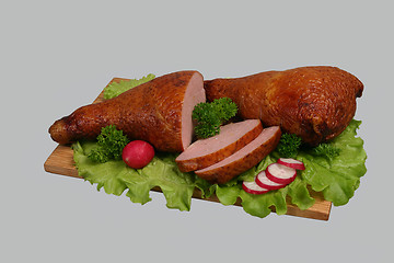 Image showing Smoked chicken on wooden board.